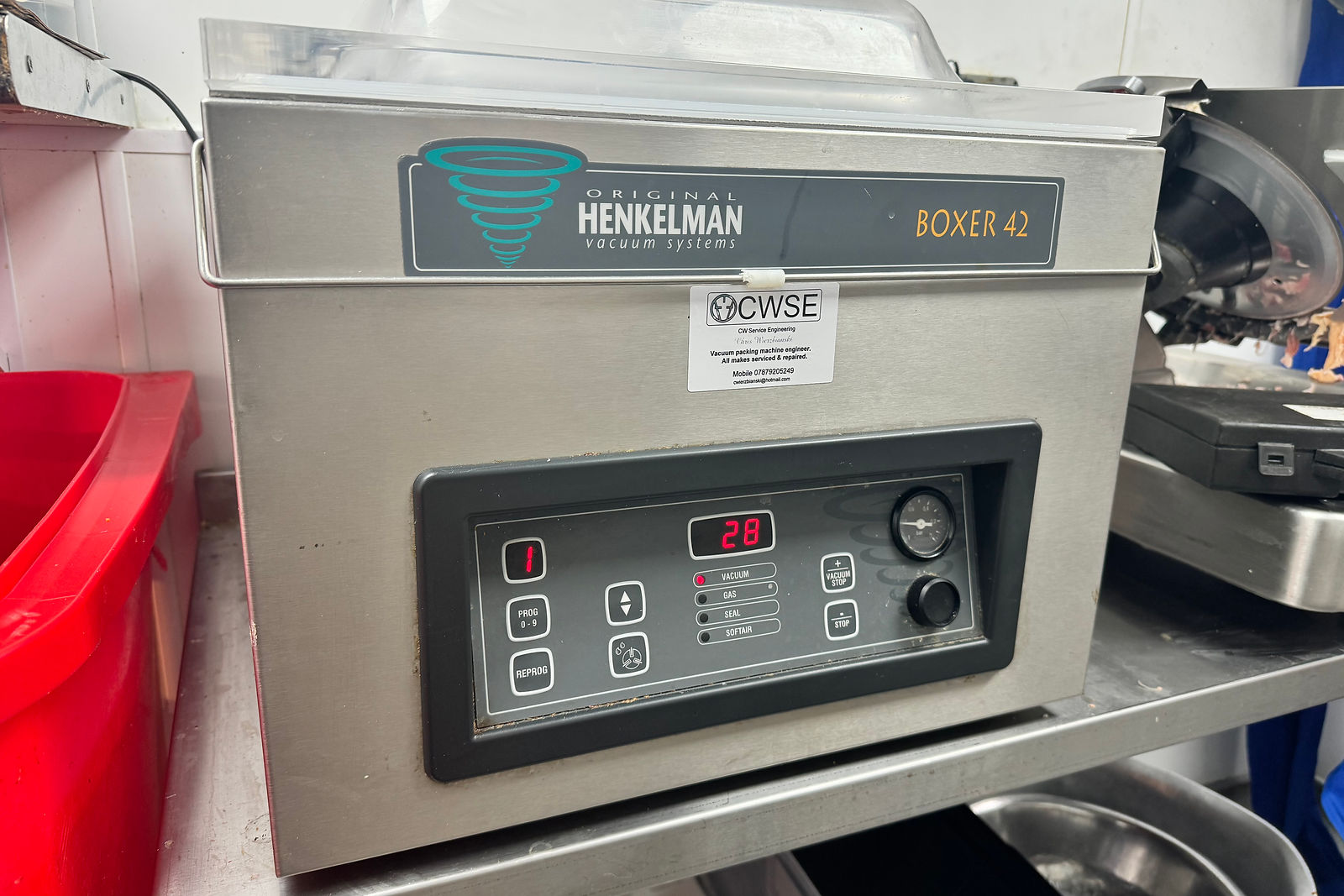 Commercial vacuum packing machine used for Cryovac-style packaging